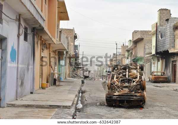 The liberated area in Iraq, the war on the Islamic\
state. Burned cars.