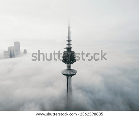 Liberation Tower in kuwait between the fog