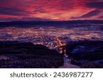 Liberec town in night, Czech Republic landscape, winter mountain forest before sunrise. Czech early morning landscape pink and violet light. Jizerske hory, north of Bohemia, piste ski slope.