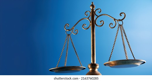 Libra Scale  Against Blue Background            