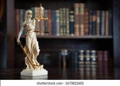 Library background. Judge's gavel on vintage lawyers desk. Legal office concept.