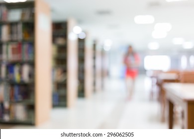 Library Blur Background With Student And Bookshelf