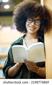 Library, Books And Education With A Woman Student Reading In A Bookstore On University Or College Campus. Study, Scholarship And Learning For An Exam And Test For Knowledge, Growth And Development