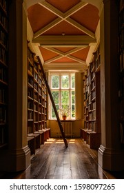 Library Bookshelf - Stock Ladder Books Lots Of Different Golden Light Inside Old Reading Section Window Glare Highlights Frame Gregynog Hall Mid Wales Welsh Country House