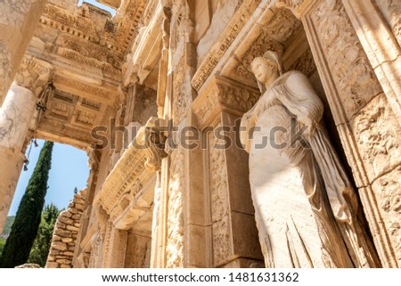 Library of Celsus in the ancient city of Ephesus, a UNESCO World Heritage site in Izmir, Turkey, closed up details with female marble statue representing virtue (Arete)