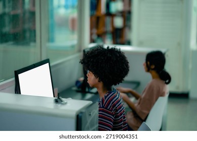 Library computer workspace with students using desktop screens showing academic research digital learning lifestyle education preparation.