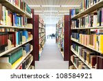 library setting with books and reading material (Please note that many books with legible titles are filler titles that only state the 