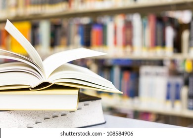 library setting with books and reading material (Please note that many books with legible titles are filler titles that only state the 'type' of materials contained within and date) - Shutterstock ID 108584906