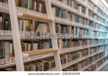 Library staircase closeup with blur multiple books on shelf in Orchard, Singapore