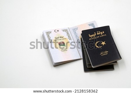 Libyan New Passport .

The translation of the Arabic words written on the cover and inside the passport is State of Libya and Passport  Сток-фото © 