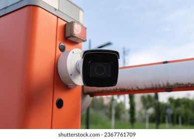 License plate reader, automatic number recognition, digital surveillance camera, boom barrier gate. Smart parking lot entrance pass automation. Vehicle access control. Car park identification system.