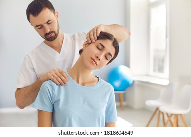 Licensed chiropractor or manual therapist doing neck stretch massage to relaxed female patient in clinic office. Young woman with whiplash or rheumatological problem getting professional doctor's help - Powered by Shutterstock