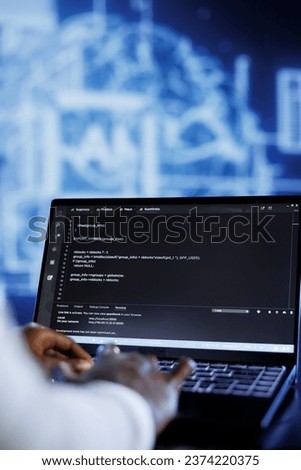 Licensed developer updates neural networks made up of interconnected nodes, writing intricate binary code scripts on laptop. Specialist uses programming to upgrade AI simulation model, close up