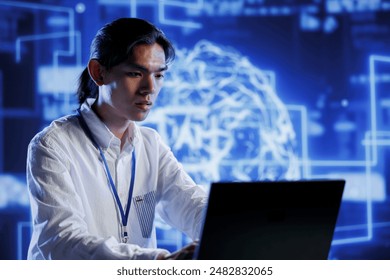 Licensed programmer in data center uses artificial intelligence computing simulating human brain through self learning algorithms. Adept professional holds laptop, working with AI deep neural networks