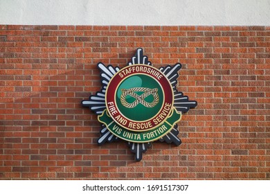 LICHFIELD, ENGLAND - NOVEMBER 4, 2019: Staffordshire Fire And Rescue Service Logo On Wall In Lichfield, England