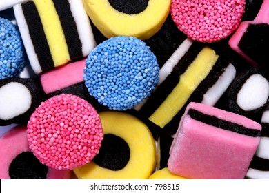 Licorice allsorts sweets forming a background..