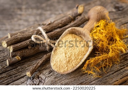 Licorice root, licorice fiber and powder in spoon on rustic background ( glycyrrhiza glabra ) Imagine de stoc © 
