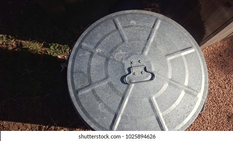 Lid Of Tin Trash Can From Above.