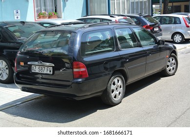 LIDO DI JESOLO, ITALY - JUNE 20, 2014: Ford Mondeo Mk 2 Popular 1990s Midsize Family Car On The City Street