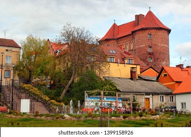 Lidzbark Warminski, Poland - May 6, 2019: The High Gate In Central  Lidzbark Warminski, A Town In The Warmian-Masurian Voivodeship In Poland And The Capital Of Lidzbark County.