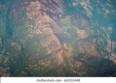 Lie Of The Ground. Alps Mountains Aerial View From The Airplane.