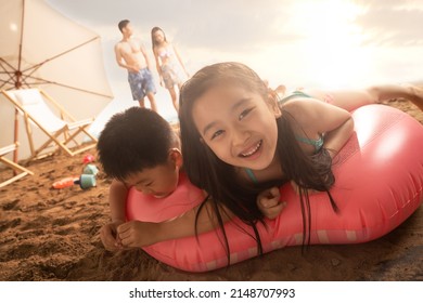 Lie Prone On Oriental Children Playing Swimming Laps