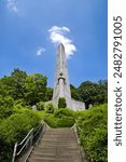 Liege, Belgium, 20.05.2024: View of the monument to the 14th Line Regiment under the blue sky. Vertical.