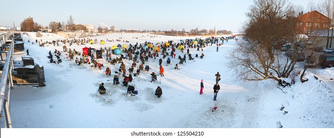 Liepaja, Latvia - JANUARY 20: People ice fishing event on frozen river, 2013 in Liepaja, Latvia - Powered by Shutterstock