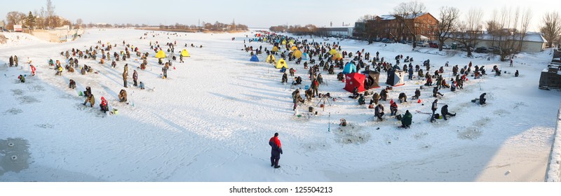 Liepaja, Latvia - JANUARY 20: People ice fishing event on frozen river, 2013 in Liepaja, Latvia - Powered by Shutterstock