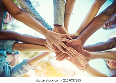 Life is amazing when you have the greatest friends around. Cropped shot of a group of friends with their hands piled on top of each other. - Shutterstock ID 2169037265