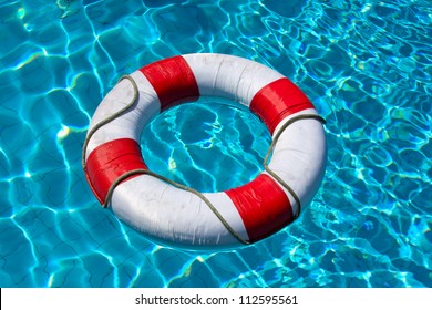 Life buoy in blue swimming pool