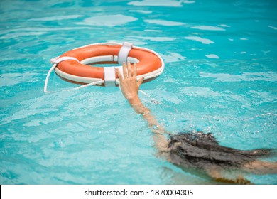 Life Buoy, Concept Of Help, Rescue. Lifebuoy In Water. Life Ring Floating In A Sea, Life Preserver. Rescue Ring. Rescuering, Safety Ring In Blue Water