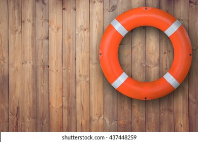 Life buoy hanging on wooden wall for emergency response when people sinking to water almost place near pool and beach 