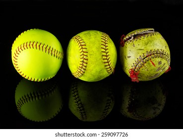 The Life Cycle Of The Softball. Three Softballs On A Different Stage Of Use