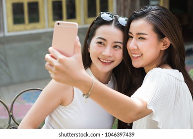 Life Of Generation Y Teenagers Hang Out In Coffee Shop Use Smartphone Play Social Media Sharing Digital Content To Each Other With Fun Take Selfie Shot