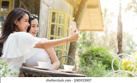 Life Of Generation Y Teenagers Hang Out In Coffee Shop Use Smartphone Play Social Media Sharing Digital Content To Each Other With Fun Take Selfie Shot