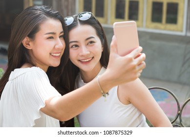 Life Of Generation Y Teenagers Hang Out In Coffee Shop Use Smartphone Play Social Media Sharing Digital Content To Each Other With Fun Take Selfie Shot