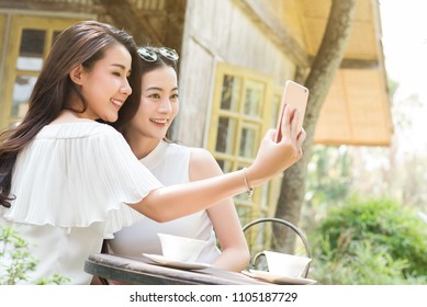 Life Of Generation Y Teenagers Hang Out In Coffee Shop Use Smartphone Play Social Media Sharing Digital Content To Each Other With Fun Take Selfie Shot