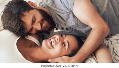 Life is gorgeous when youre in love. Shot of an affectionate young couple sharing a romantic moment in the bedroom at home. - Powered by Shutterstock