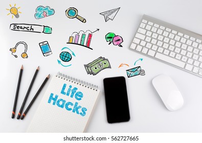Life Hacks. Office desk table with computer, Smartphone, note pad, pencils