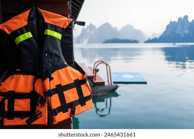 Life jackets hang outside the homestay, with beautiful mountain views in the morning.