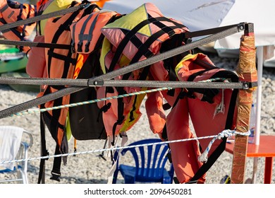 Life Jackets On The Beach. Water Safety Concept.