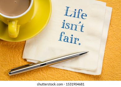 Life Is Not Fair  - A Bitter Wisdom Quote On A Napkin With A Cup Of Coffee