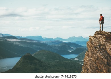 Life on the edge Traveler on cliff mountains over fjord enjoying Norway landscape Travel Lifestyle success motivation concept adventure active vacations outdoor - Shutterstock ID 749419873