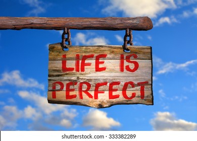 Life is perfect motivational phrase sign on old wood with blurred background