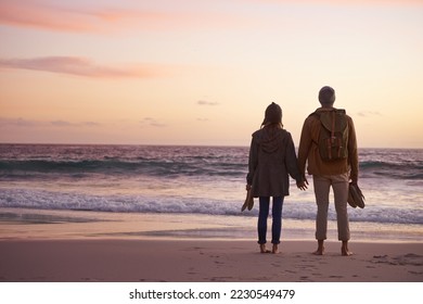 Life is perfect when Im with you. Shot of a couple enjoying a romantic evening on the beach at sunset. - Shutterstock ID 2230549479