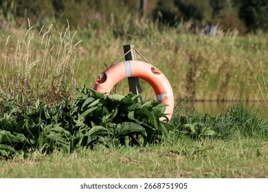 Life preserver floatation device situated at an inland lakeside location