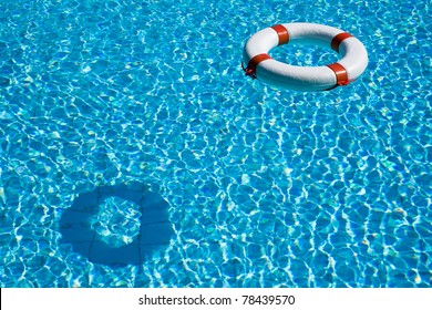 Life Preserver Floating In A Clear Pool Water