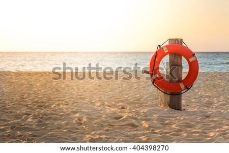 Life preserver on sandy beach somewhere in Mexico