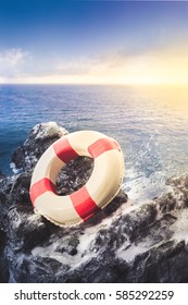 Life Preserver Ring On A Rocky Surface At Sea